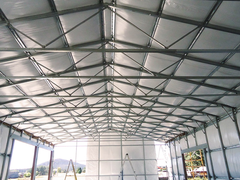 Metal building install insulation